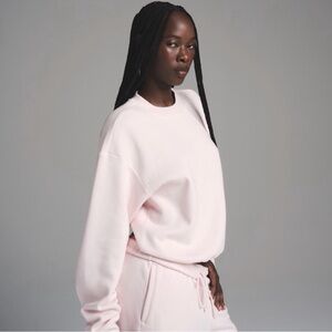 Skims fleece off pink crewneck